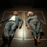 Gene Hackman and Betsy Arakawa lying on a wooden floor , outlined with white chalk-like markings, in a dimly lit room.